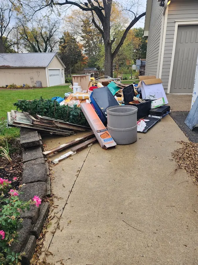 Dumpster being loaded with debris for Demolition Dumpster Rental in Rensselaer